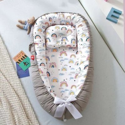 Réducteur de lit bébé cocon sécurisant joli confort