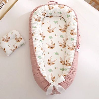 Réducteur de lit bébé cocon sécurisant rose