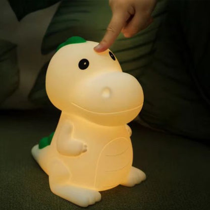 Veilleuse dino s'allume en la touchant